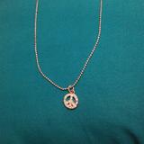 American Eagle Outfitters Jewelry | Ae Peace Sign Dainty Necklace | Color: Silver | Size: Os