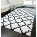 Blue/White 60 x 1.6 in Area Rug - House of Hampton® Feather Shag Contemporary Ivory Navy Quatrefoil Area Rug Polypropylene | 60 W x 1.6 D in | Wayfair
