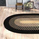 Black/White 144 x 0.5 in Area Rug - August Grove® Calden Braided Black/Cuban Sand Indoor/Outdoor Area Rug Polypropylene | 144 W x 0.5 D in | Wayfair