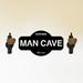 East Urban Home Personalized Man Cave Unique Steel Metal Wall Sign Metal in Black | 24 H x 24 W x 0.06 D in | Wayfair