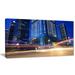 Design Art Light Trails in Blue City Photographic Print on Wrapped Canvas