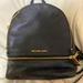 Michael Kors Bags | Michael Kors Black Rhea Backpack | Color: Black/Gold | Size: Os