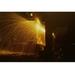 Buyenlarge Welder's Torch Has Sparks Fly on Locomotive Factory Floor - Photograph Print in Black/Yellow | 20 H x 30 W x 1.5 D in | Wayfair