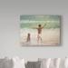 Trademark Fine Art 'Boy & Dog, Lifeguard' Oil Painting Print on Wrapped Canvas in Green | 14 H x 19 W x 2 D in | Wayfair BL01806-C1419GG