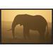 East Urban Home 'African Elephant Silhouetted at Sunset' Framed Photographic Print on Canvas in Brown/Yellow | 12 H x 18 W x 1.5 D in | Wayfair