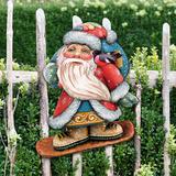 The Holiday Aisle® Decorative Downslope Santa Scenic Wood Ornament Wood/Resin/Plastic in Brown | 5.5 H x 3.5 W x 0.5 D in | Wayfair