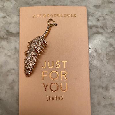 Anthropologie Accessories | Anthropologie Gold Feather Cz Charm | Color: Gold | Size: Os