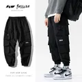 Pantalon cargo noir avec poches pour homme streetwear sarouel survêtement hip hop décontracté