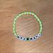 Disney Jewelry | Disney Mike Wazowski Beaded Bracelet | Color: Green/White | Size: Various