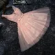 Robe de bal rose élégante col en V court perles appliquées à lacets longueur genou robe de fête