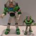 Disney Toys | Disney Pixar Toy Story Buzz Lightyear Lot Of 2 Action Figures, 5.5" Big Is Vinta | Color: Green/White | Size: 5.5"
