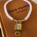 Louis Vuitton Jewelry | Lock Necklace | Color: Gold/White | Size: Os
