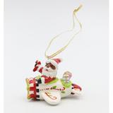 The Holiday Aisle® African American Santa Flying Airplane Hanging Figurine Ornament /Porcelain in Red/White | 3.75 H x 4.375 W x 3.75 D in | Wayfair