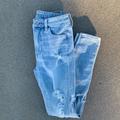 American Eagle Outfitters Jeans | American Eagle Ripped The Dream Jean Super Hi Rise Jegging Jean Light Wash | Color: Blue | Size: 0