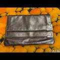 Michael Kors Bags | Michael Kors Metallic Grey/Silver Leather Clutch | Color: Gray/Silver | Size: Medium