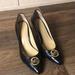 Michael Kors Shoes | Micheal Kors Black Leather Heels Size 8 Gold Logo Point Toe | Color: Black | Size: 8