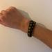 Brandy Melville Jewelry | Brandy Melville Wrap/Snap Bracelet | Color: Black/Gold | Size: Os