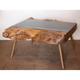 A Bur Wood & Smoked Glass Coffee Table Raised on Angled Tapering Supports