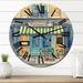 Designart 'A Small French Bakery Under A Striped Marquee' French Country wall clock