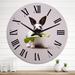 Designart 'Black And White Rabbit With Green Leaf' Traditional wall clock