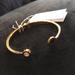 Kate Spade Jewelry | Kate Spade Black Spade Logo Bangle | Color: Black/Gold | Size: Os