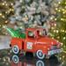 The Holiday Aisle® Christmas Old Style Truck w/ Tree Metal in Red | 9.25 H x 21 W x 9 D in | Wayfair 2594D3870BF64DD6A916BE8722105298