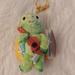 Disney Accessories | Firm! Nwt Disney Aulani Resort Duffy And Friends Keychain/Bag Charm | Color: Green/Yellow | Size: Os