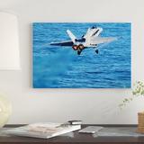 East Urban Home 'An F/A-18C Hornet Taking off' Photographic Print on Canvas Canvas, Cotton in Blue | 12 H x 18 W x 1.5 D in | Wayfair