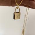 Louis Vuitton Jewelry | Lv Lock Necklace | Color: Gold | Size: Os