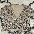 Brandy Melville Tops | Brandy Melville Tops | Brandy Melville Leopard Animal Print Wrap Crop Top. | Color: Black/Tan | Size: One Size