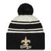 Men's New Era Cream/Black Orleans Saints 2022 Sideline Sport Cuffed Pom Knit Hat