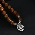 Collier de perles en bois pour hommes chapelet bouddhiste OM Lotus bouddha arbre de vie creux