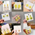 Boucles d'oreilles pendantes en métal jaune pour femmes bijoux d'oreille géométriques perle