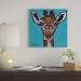East Urban Home 'Baby Cakes The Giraffe' by Hippie Hound Studios Graphic Art Print on Wrapped Canvas Canvas, in Black/Blue/Green | Wayfair