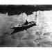 High angle view of a man sitting on a rowboat and fishing in a lake Poster Print (24 x 36)