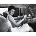 Posterazzi Young Woman Sitting in the Drivers Seat of a Car & Smiling Poster Print - 18 x 24 in.