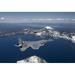 Two F-15 Eagles from the 173rd Fighter Wing fly over Crater Lake in Central Oregon Poster Print (34 x 23)