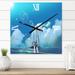 Designart 'The Sailboat On The Blue Sea Against Summer Sky' Nautical & Coastal Metal Wall Clock