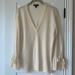 J. Crew Sweaters | J. Crew Vanilla Cream Merino Wool V-Neck Sweater With Bow Wrists Size Medium Euc | Color: Cream/White | Size: M