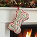 The Holiday Aisle® Initial Personalized Bone Shape Stocking Polyester in Green/Red/White | 10 H x 18 W in | Wayfair