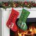 The Holiday Aisle® Large Initial & Name Personalized Red Trim Stocking Polyester in Black/Red/White | 10 H x 16 W in | Wayfair