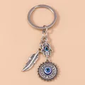 Porte-clés main Hamsa pour hommes et femmes mauvais œil œil bleu plume de soleil pendentif de