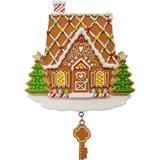 The Holiday Aisle® Our First Home Gingerbread Hanging Figurine Ornament Ceramic/Porcelain in Brown/Green | 3 H x 4 W x 1 D in | Wayfair