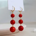 Boucles d'oreilles coréennes à long pompon pour femmes boule de perle rouge boucles d'oreilles