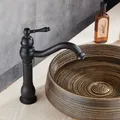Robinets de lavabo Bronze frotté à l'huile robinet de salle de bains à poignée unique monté sur le