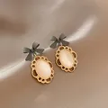 Boucles d'oreilles coréennes ovales en opale pour femmes bijoux d'oreille de mariage nœud