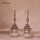 Boucles d'oreilles plaquées or blanc 18 carats micro-incrustées conium contre-indiqué perle