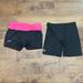 Under Armour Shorts | 2 Pairs Under Armour Women’s Shorts Sz Medium Black Pink | Color: Black/Pink | Size: M