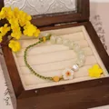 Bracelet en Jade Hetian naturel pour femmes petites perles en fleur de pêche corde tressée