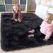 Black 96 x 60 x 1.7 in Area Rug - Mercer41 Kameia Solid Color Machine Woven Rectangle 5' x 8' Area Rug in Faux Fur | 96 H x 60 W x 1.7 D in | Wayfair